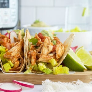 Shredded Chicken Tacos on a cutting board